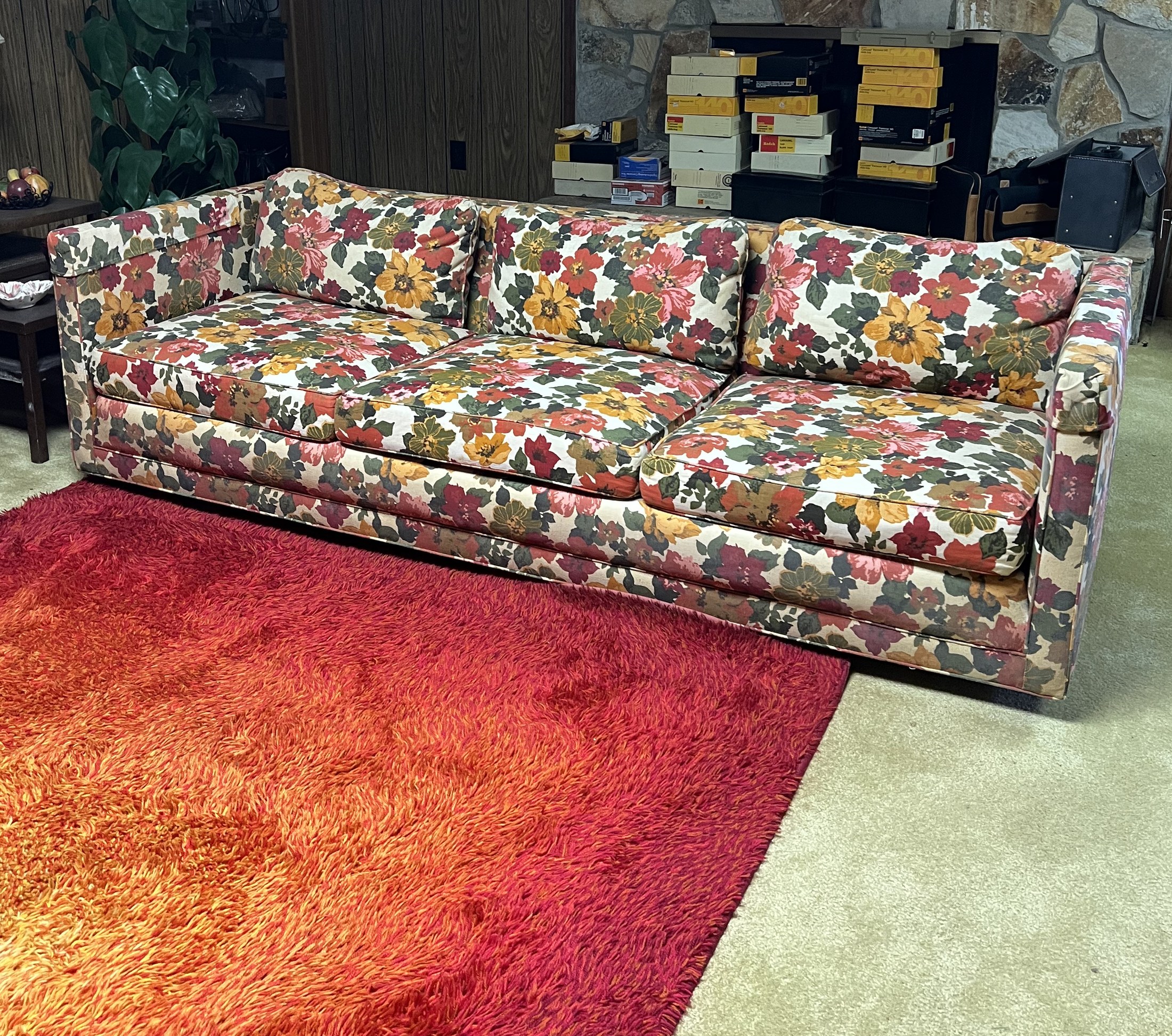 Vintage Flair Inc sofa with multicolor floral upholstery in a Sandy Springs living room