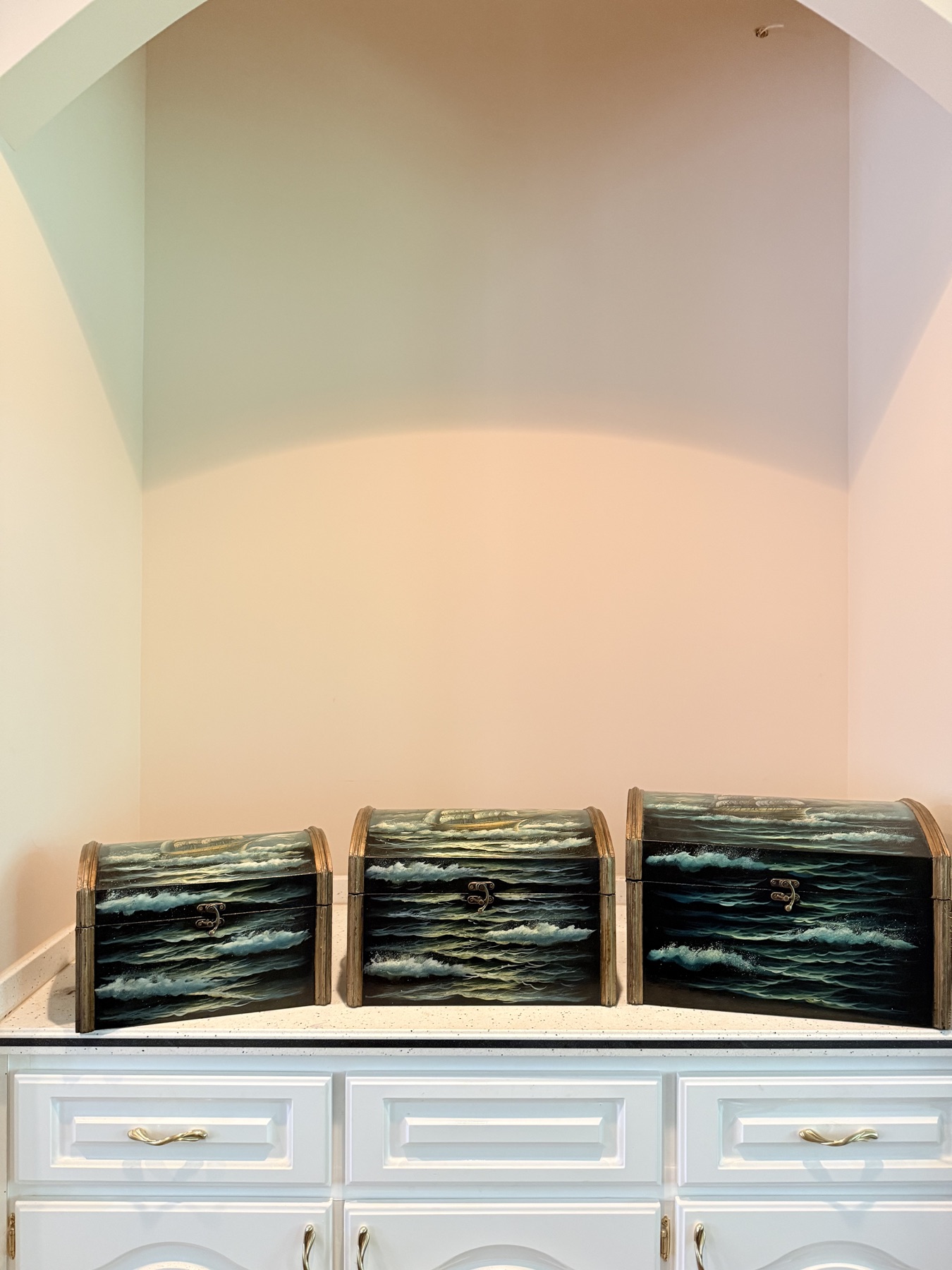 Three coordinated blue-green painted nesting chests