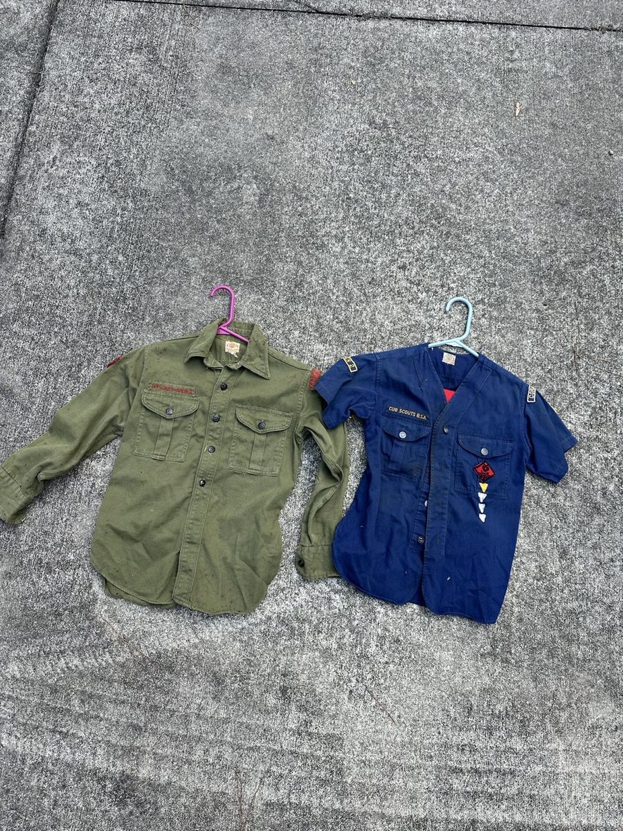 Vintage green shirt and blue work uniform displayed together